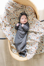 Load image into Gallery viewer, baby in bassinet wearing organic cotton non-toxic ribbed knot gown and headband