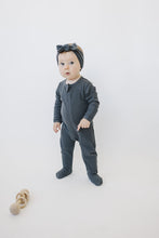 Load image into Gallery viewer, baby girl standing up wearing organic cotton non-toxic zipper onesie footed pajamas by mebie baby