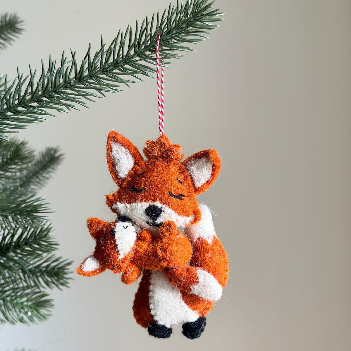 Fox Holding Baby Ornament – Handmade Wool Felt Holiday Decor
