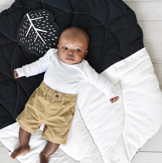 baby laying on wee gallery organic cotton non-toxic eco-friendly nature acorn baby playmat