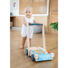 Load image into Gallery viewer, baby pushing eco-friendly non-toxic wooden baby walker by plantoys with building blocks
