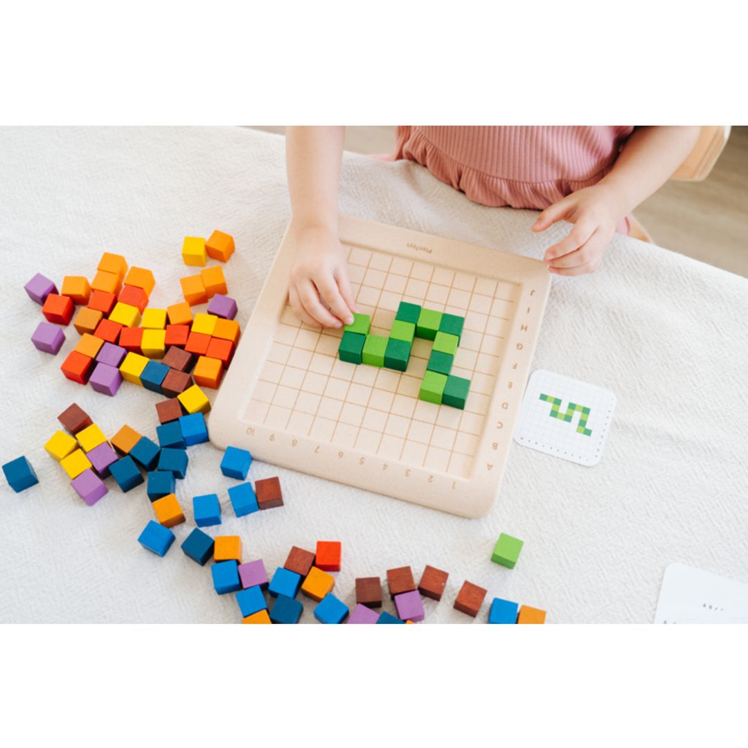 child playing with plantoys eco-friendly non-toxic wooden counting cubes