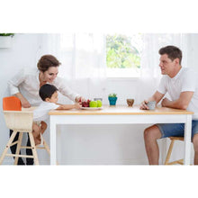 Load image into Gallery viewer, little boy sitting at the table in sustainable non-toxic wooden high chair by plantoys 
