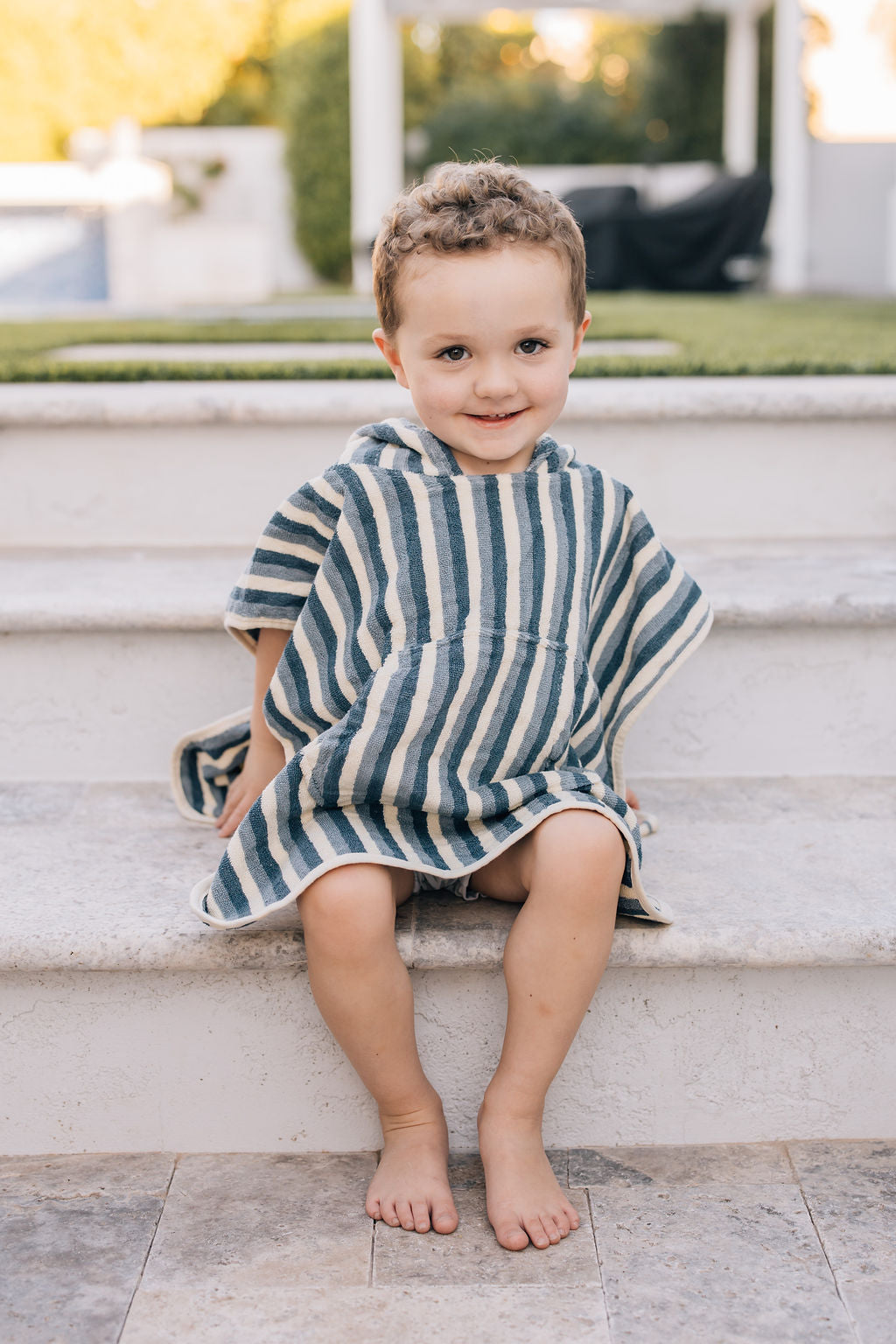 organic cotton beach hooded poncho non toxic eco-friendly sustainable beach boy wearing
