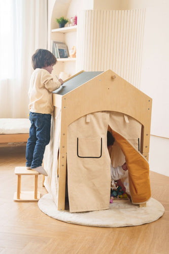 boy drawing on black board top of the wooden convertible playhouse by avenlur