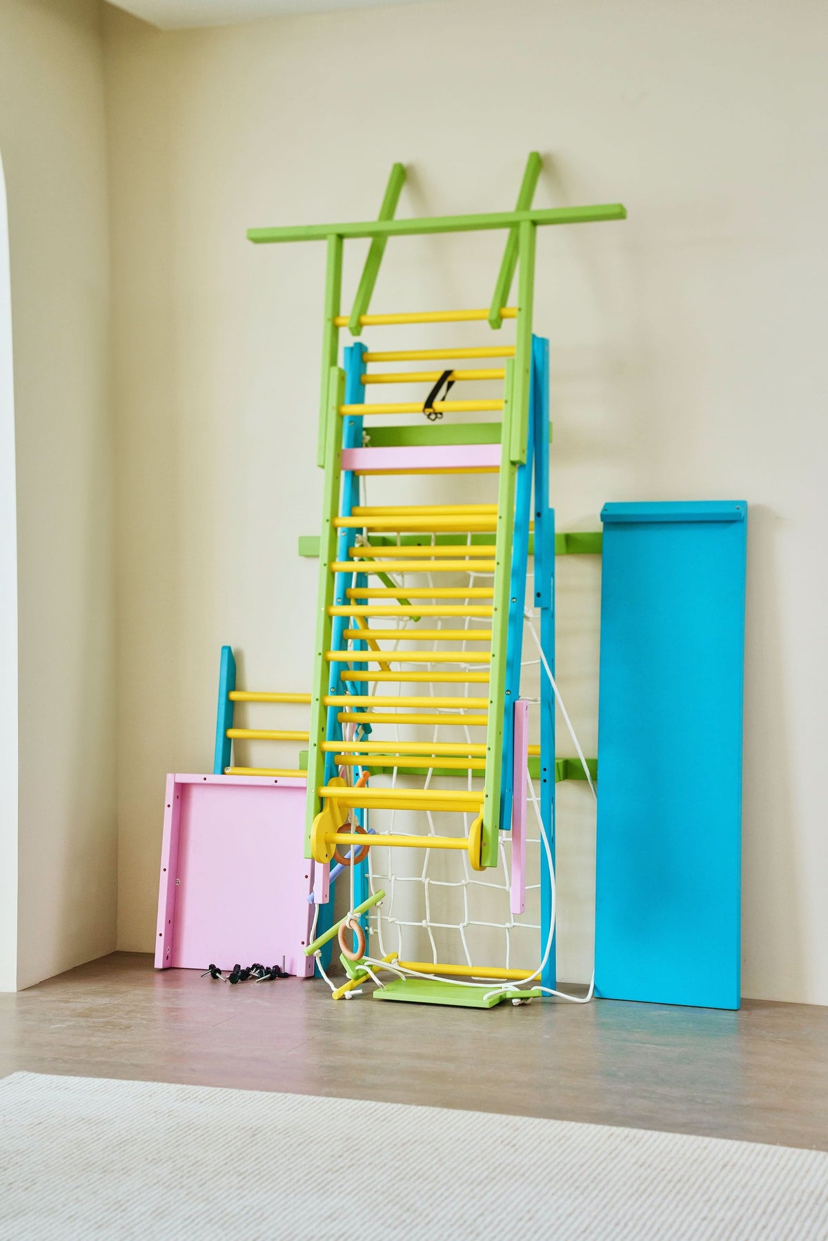 Avenlur Grove 8-in-1 Foldable Wall-Mounted Indoor Jungle Gym with Slide, Rope Net & Swing
