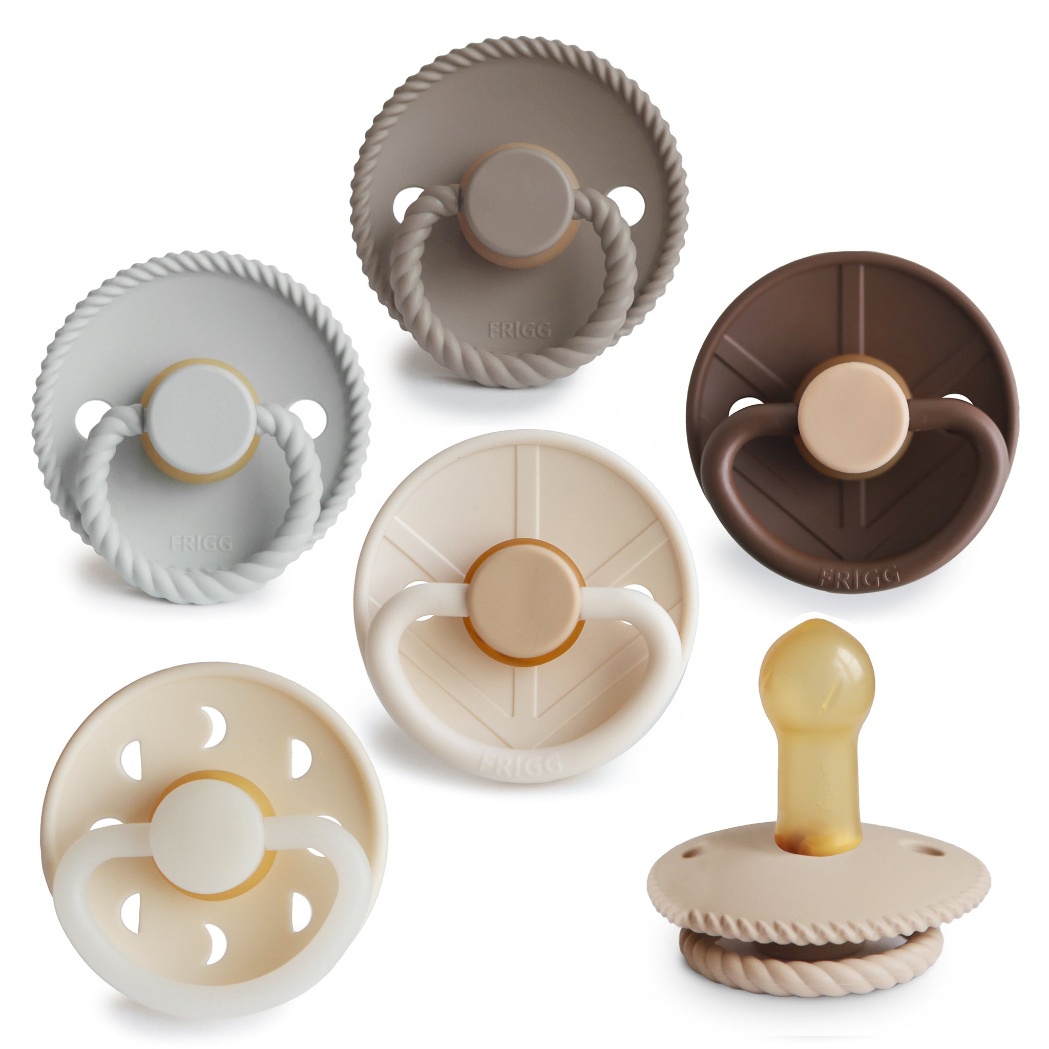 A collection of colorful FRIGG pacifiers in various designs.