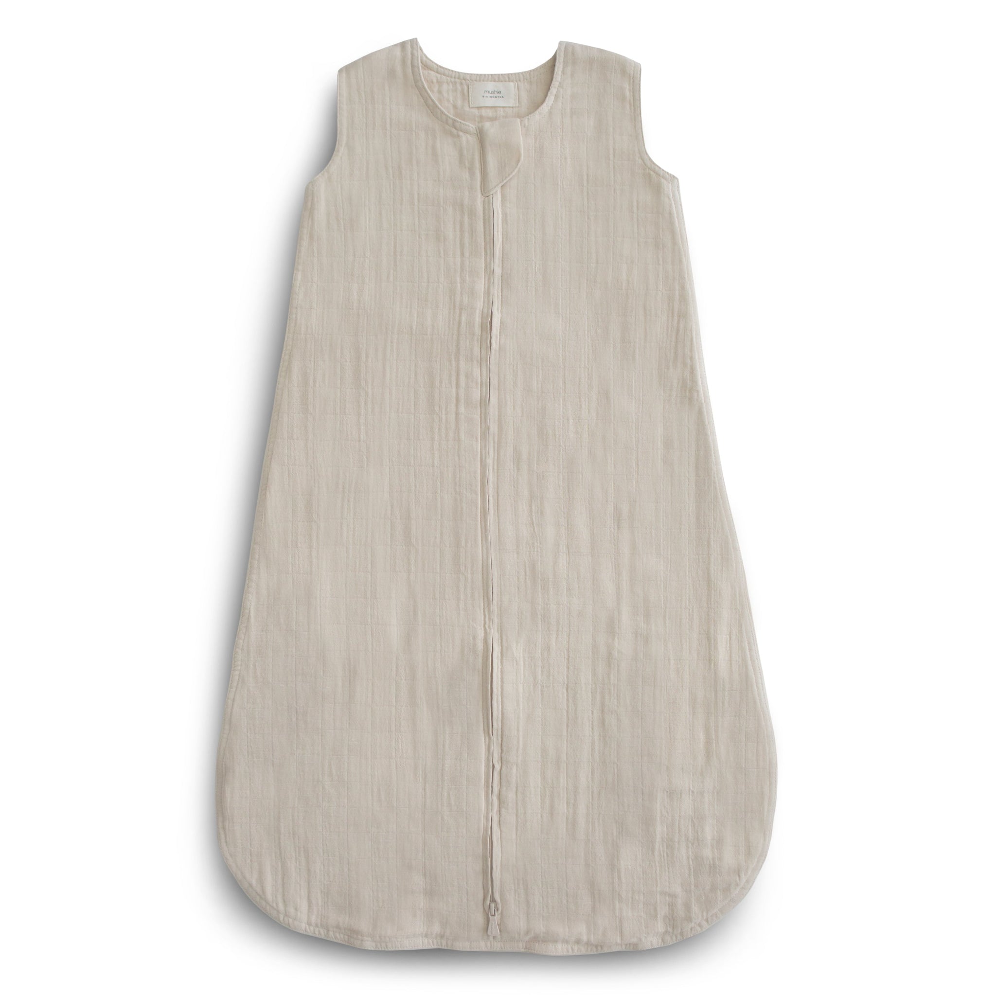Mushie organic muslin cotton wearable blanket in a soft, neutral color.
