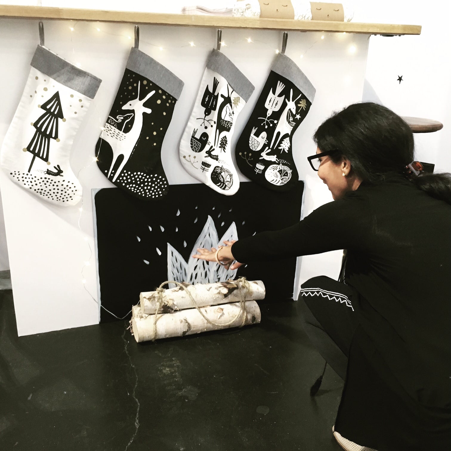 fireplace mantel with 4 black and white minimalist organic cotton non-toxic eco-friendly stockings by wee gallery nature-inspired