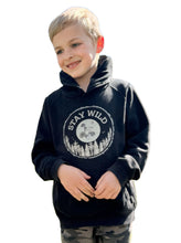 Load image into Gallery viewer, Child wearing organic nature themed hoodie with slogan &quot;Stay wild&quot; 
