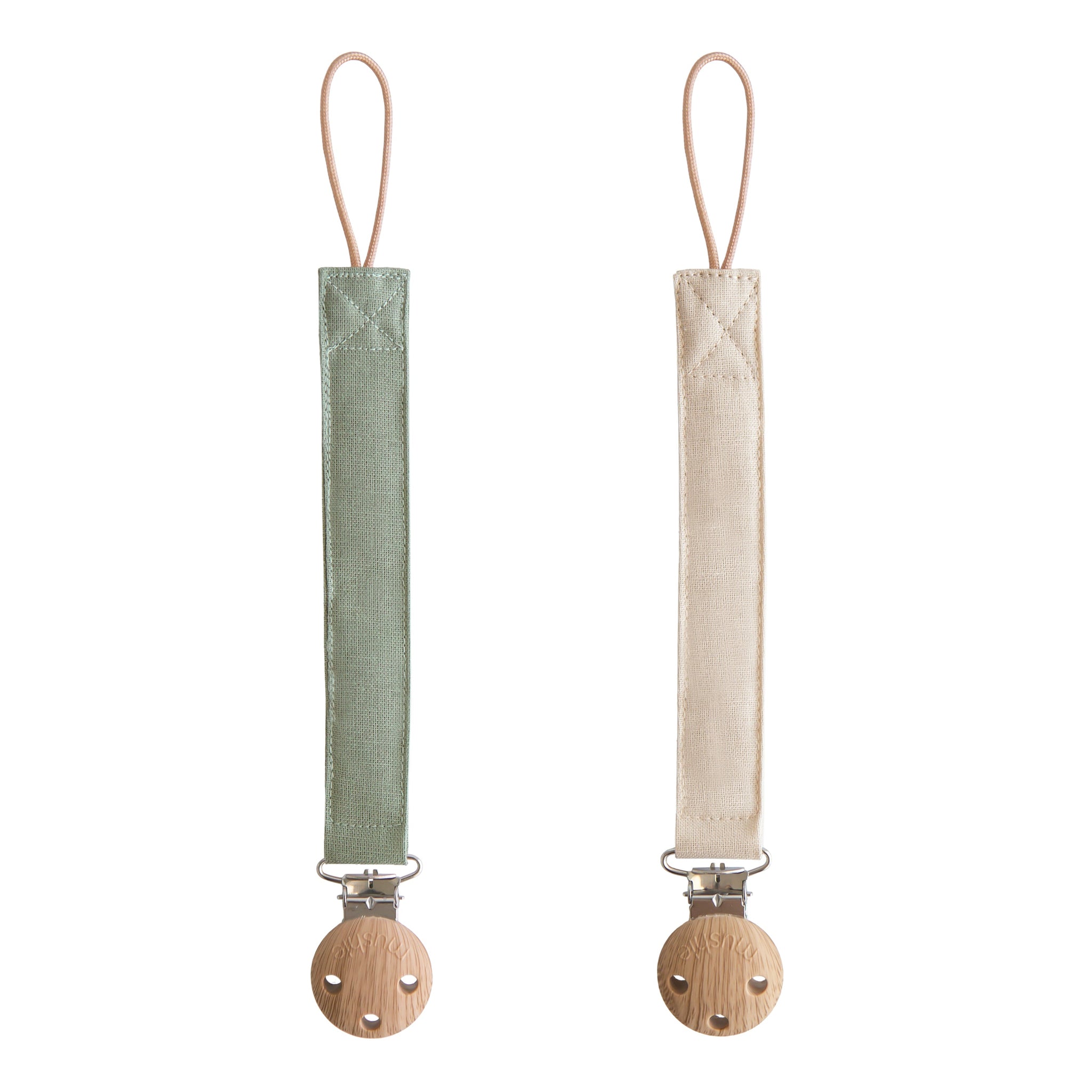 Two natural linen pacifier clips from Mushie in olive and sand colors.