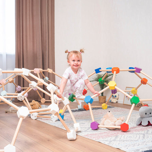 little girl climbing eco-friendly and non-toxic wooden indoor climbing domes by wood and hearts