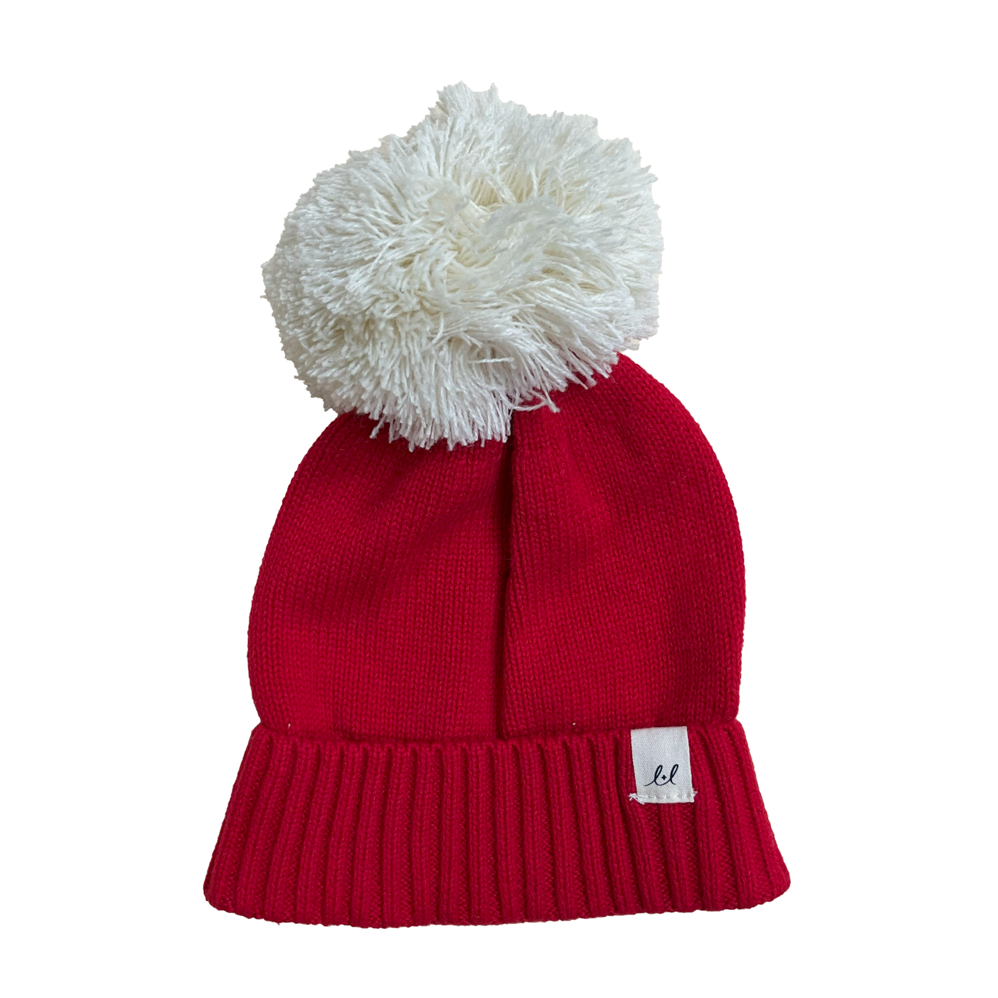 A festive red organic cotton baby beanie with a pom pom from Luca + Luna.