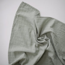 Load image into Gallery viewer, Mushie Organic Cotton Muslin Swaddle Blanket
