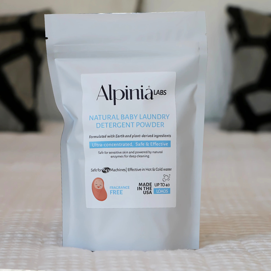 Alpinia Labs Baby Laundry Detergent in a sleek, modern bottle.