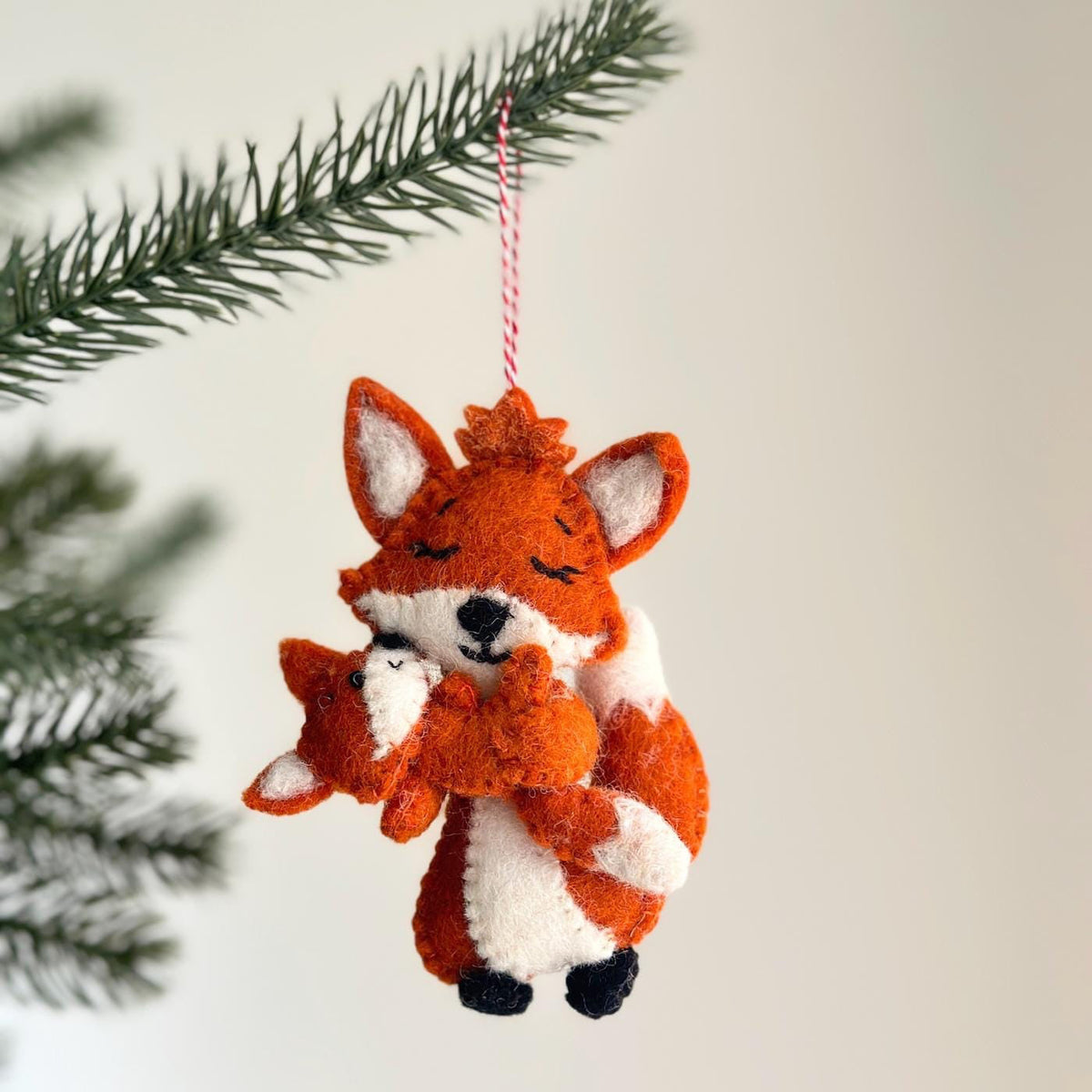 Fox Holding Baby Ornament – Handmade Wool Felt Holiday Decor