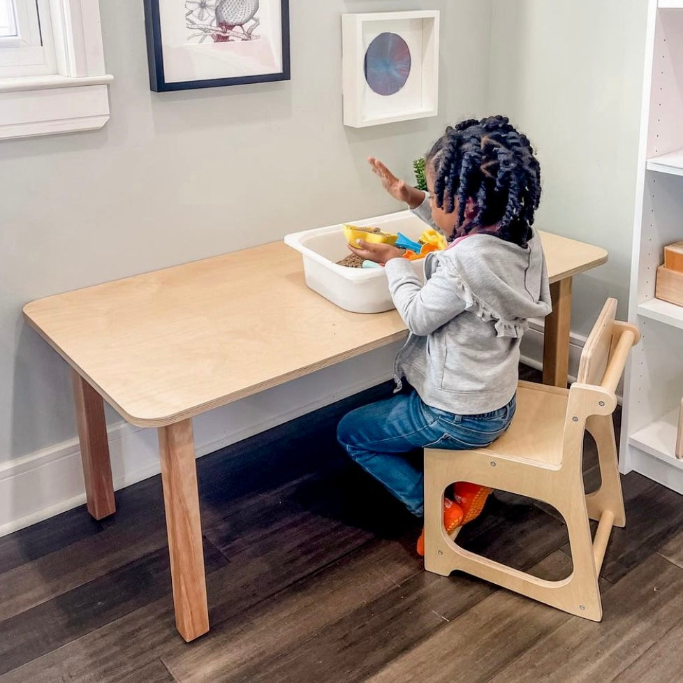 A child-sized wooden table and chair set made from sustainable bamboo.