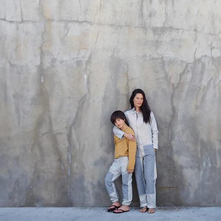 mom and son in matching organic cotton coveralls