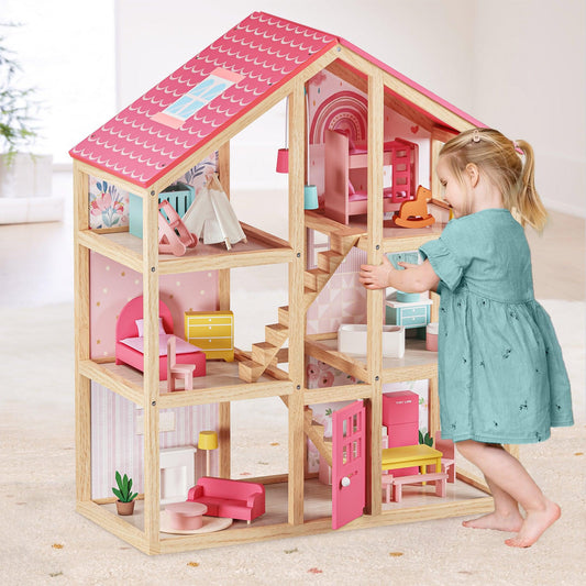 little girl playing with wooden sustainable doll house with furniture by tiny land