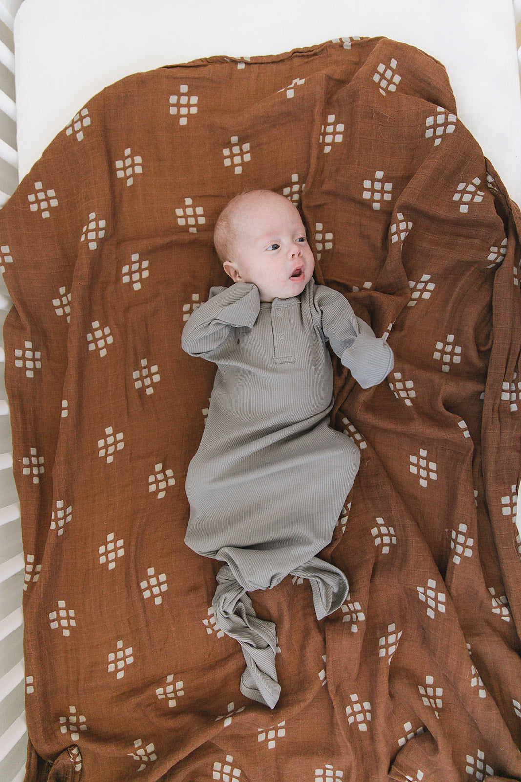 baby on blanket wearing organic cotton ribbed knot gown non-toxic eco-friendly